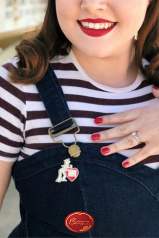 Bésame girl wearing a black and white stripped shirt and matching nail polish and lipstick Bésame Red